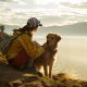 luxury real estate agenda: women sitting with dog on top of hike