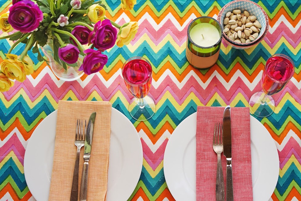 colourful table cloth with bright table settings in this Kelowna outdoor space