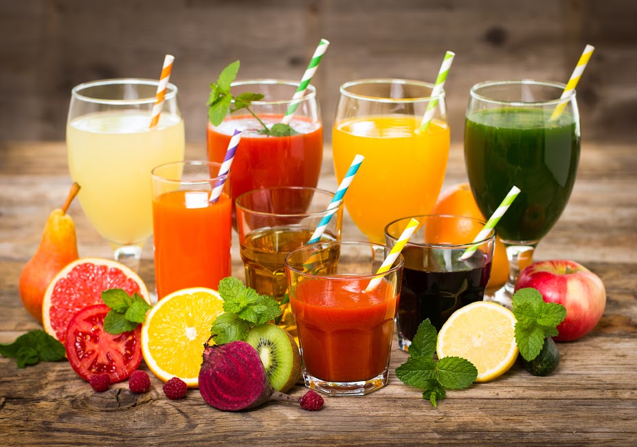 assortment of glasses filled with smoothies and juices