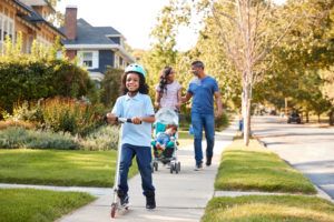 Family walking down the road in Kelowna