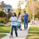 Family walking down the road in Kelowna